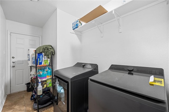 820 Carver St, Waco, TX 76704 - laundry area featuring tile patterned flooring, laundry area, and washing machine and dryer