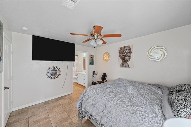 820 Carver St, Waco, TX 76704 - bedroom featuring light tile patterned floors, visible vents, baseboards, ensuite bath, and ceiling fan