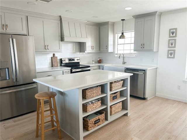 kitchen with premium range hood, open shelves, appliances with stainless steel finishes, light wood finished floors, and light countertops