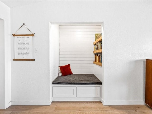 mudroom with light wood-type flooring and baseboards