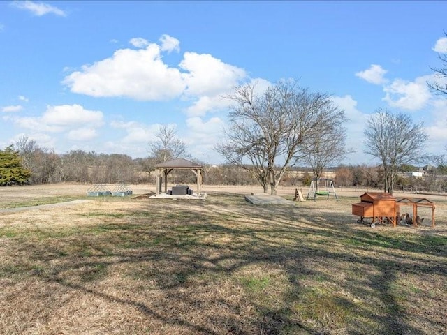 view of yard with a gazebo and an outdoor structure