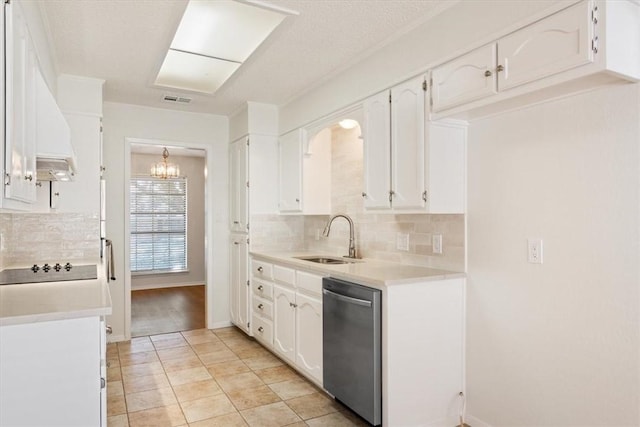 kitchen featuring a sink, tasteful backsplash, visible vents, white cabinetry, and dishwasher