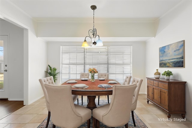 dining space featuring baseboards and light tile patterned floors