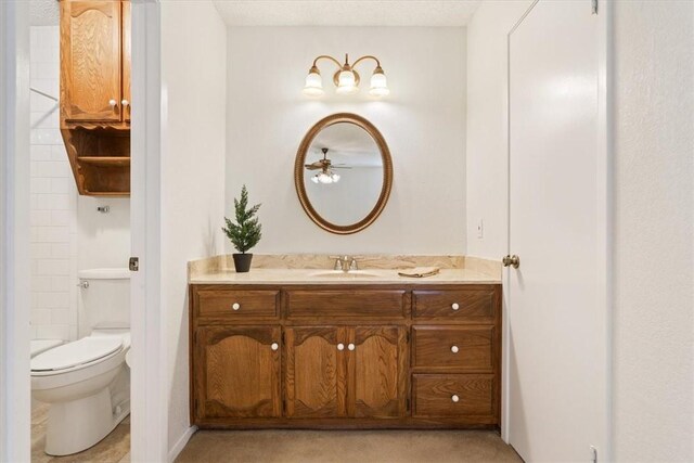 bedroom featuring ceiling fan, baseboards, and carpet