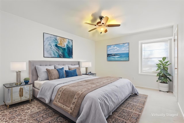 bedroom featuring a ceiling fan and baseboards