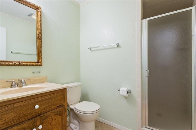 bathroom featuring tile patterned flooring, toilet, vanity, baseboards, and a stall shower