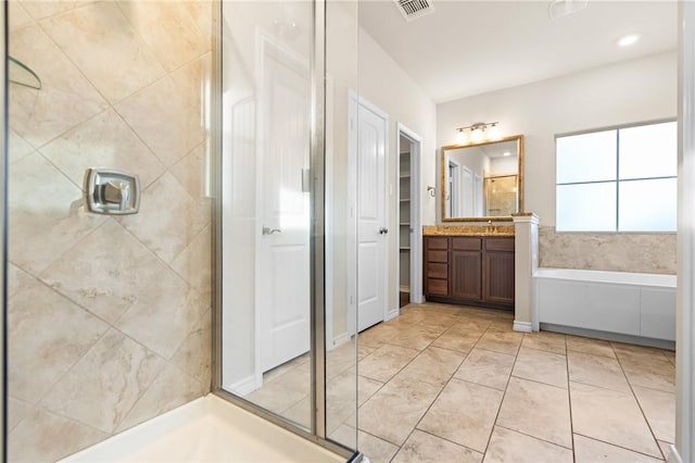 full bath featuring vanity, a bath, visible vents, and a stall shower