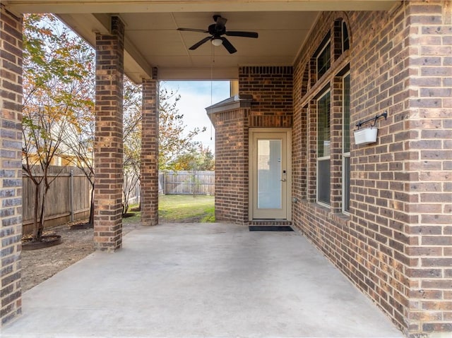 view of patio featuring a fenced backyard and a ceiling fan