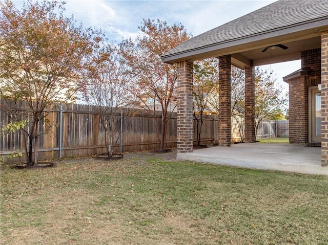 view of yard featuring a patio area and a fenced backyard