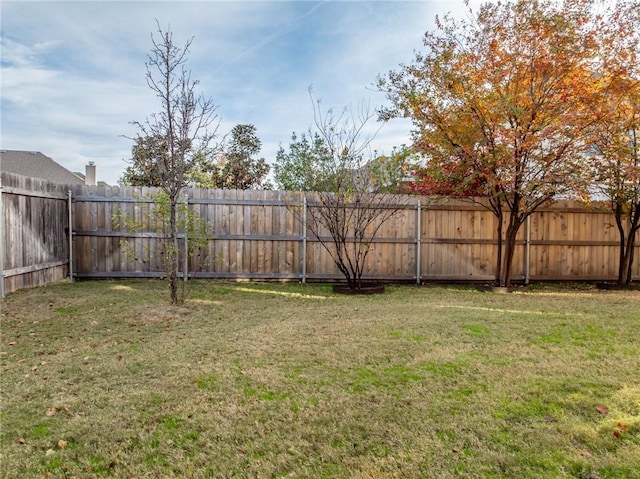 view of yard with a fenced backyard