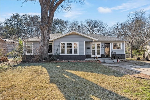 view of front of house with brick siding and a front yard