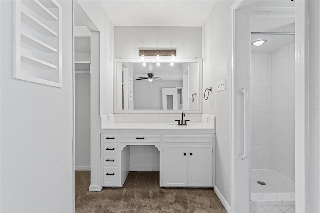 full bath with vanity, baseboards, a stall shower, and ceiling fan