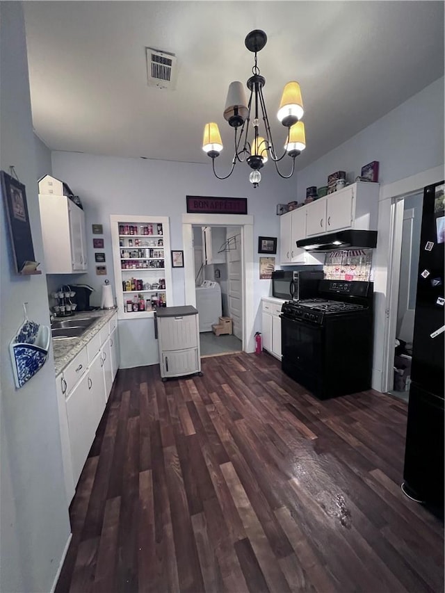 kitchen featuring visible vents, black appliances, under cabinet range hood, an inviting chandelier, and white cabinets