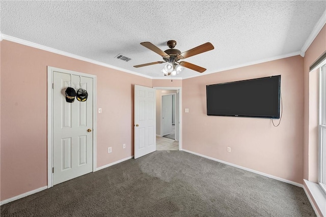 301 Whispering Meadows Dr, Hewitt, TX 76643 - unfurnished bedroom with crown molding, a textured ceiling, carpet floors, ceiling fan, and baseboards