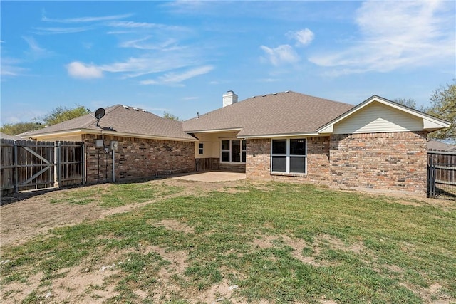 301 Whispering Meadows Dr, Hewitt, TX 76643 - back of house with a patio, brick siding, a chimney, and roof with shingles