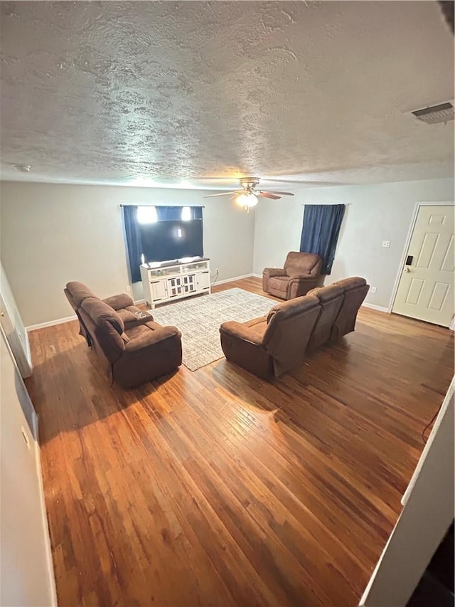 202 Coryell City Rd, Gatesville, TX 76528 - living room featuring wood finished floors, baseboards, and a textured ceiling