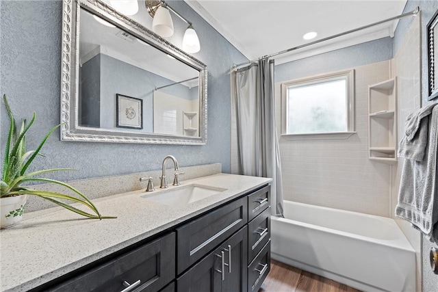 bathroom with vanity, shower / bath combo with shower curtain, and wood finished floors