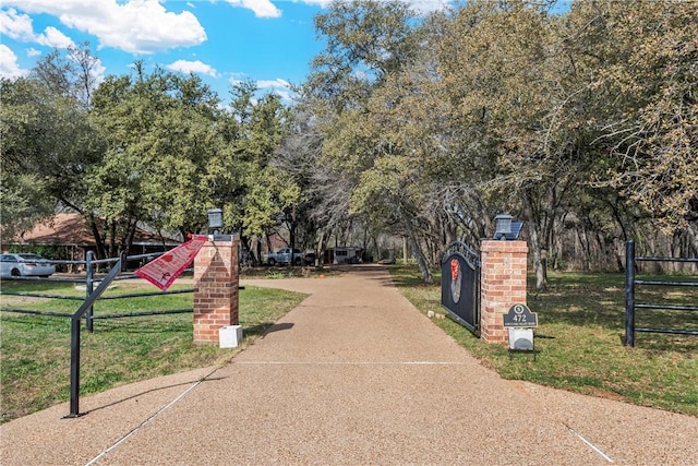 surrounding community featuring a yard and fence