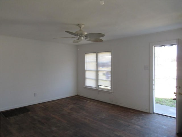 2800 Speight Ave, Waco, TX 76711 - spare room with dark wood finished floors, visible vents, a healthy amount of sunlight, and a ceiling fan