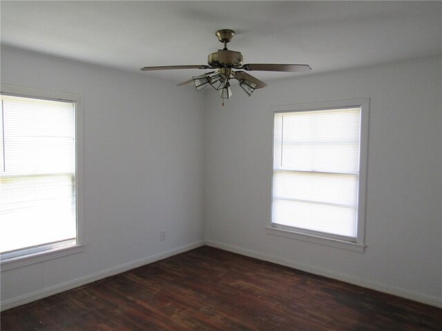 2800 Speight Ave, Waco, TX 76711 - unfurnished room with baseboards, dark wood-style floors, and a ceiling fan