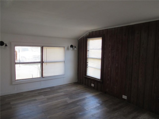 2800 Speight Ave, Waco, TX 76711 - unfurnished room with vaulted ceiling and wood finished floors