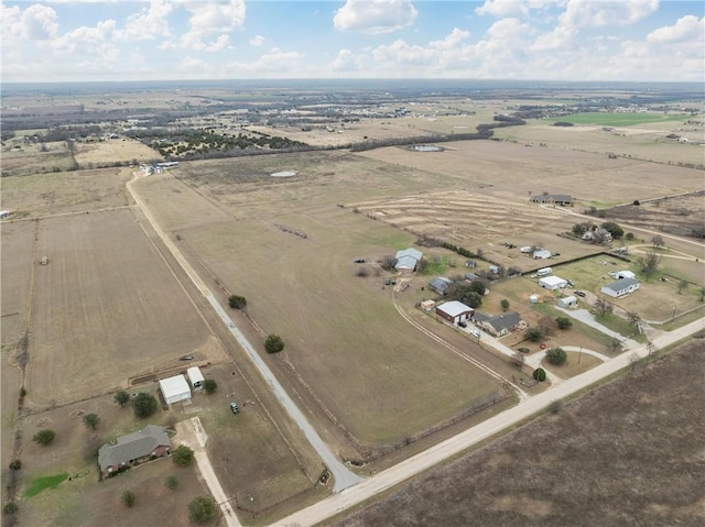 aerial view of property and surrounding area featuring rural landscape