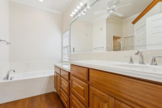 full bathroom featuring a sink, double vanity, ceiling fan, and crown molding