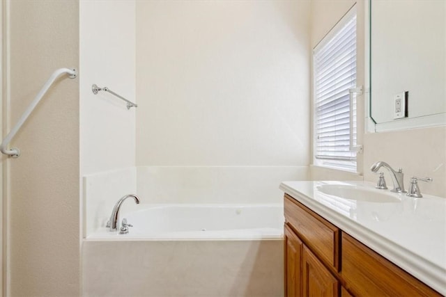 full bath with vanity and a bath
