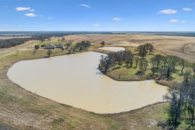 birds eye view of property with a water view and a rural view