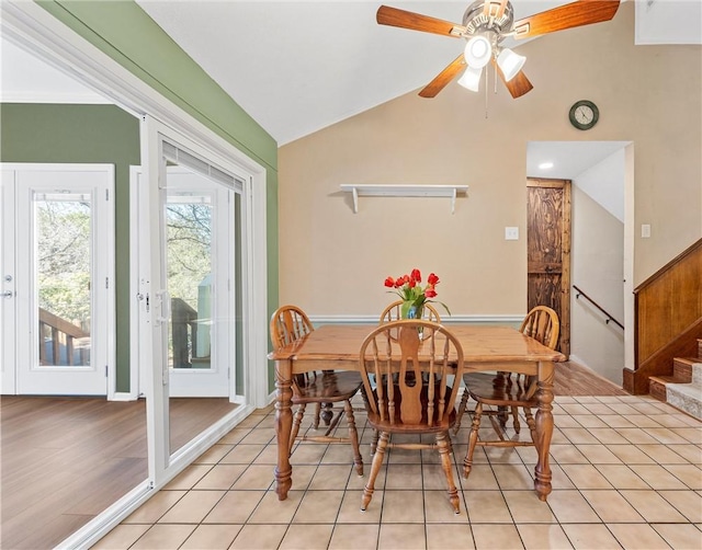 1016 Cardinal Dr, Woodway, TX 76712 - dining area featuring lofted ceiling, ceiling fan, stairs, and light tile patterned flooring