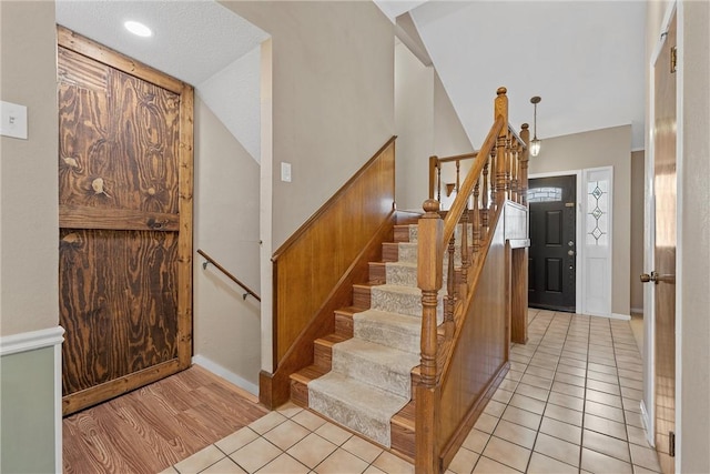 1016 Cardinal Dr, Woodway, TX 76712 - staircase featuring tile patterned floors and baseboards