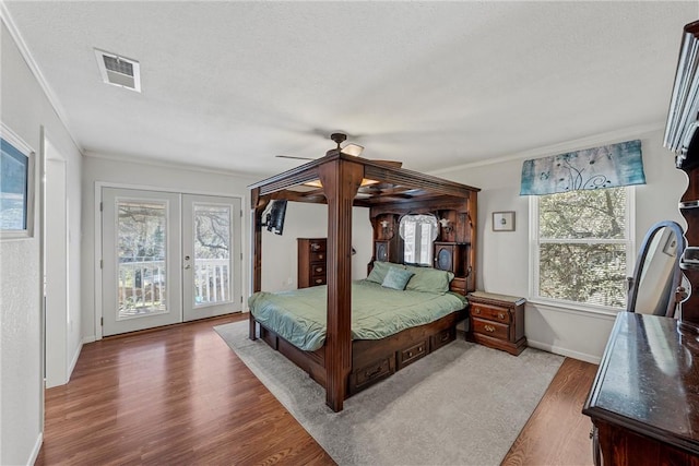 1016 Cardinal Dr, Woodway, TX 76712 - bedroom with wood finished floors, access to outside, french doors, crown molding, and baseboards