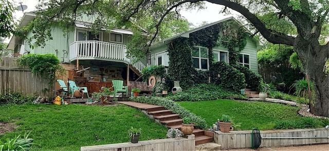 1016 Cardinal Dr, Woodway, TX 76712 - rear view of house featuring stairway
