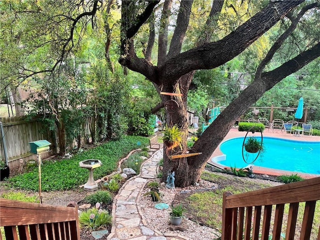 1016 Cardinal Dr, Woodway, TX 76712 - fenced backyard featuring an outdoor pool and a patio