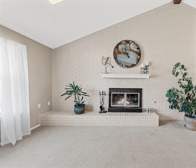 1016 Cardinal Dr, Woodway, TX 76712 - carpeted living area with lofted ceiling, a brick fireplace, brick wall, and baseboards