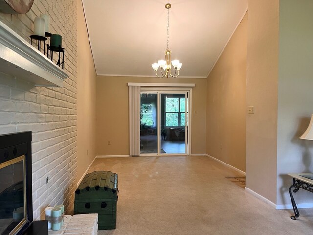 1016 Cardinal Dr, Woodway, TX 76712 - unfurnished dining area featuring crown molding, carpet flooring, baseboards, a fireplace, and a chandelier