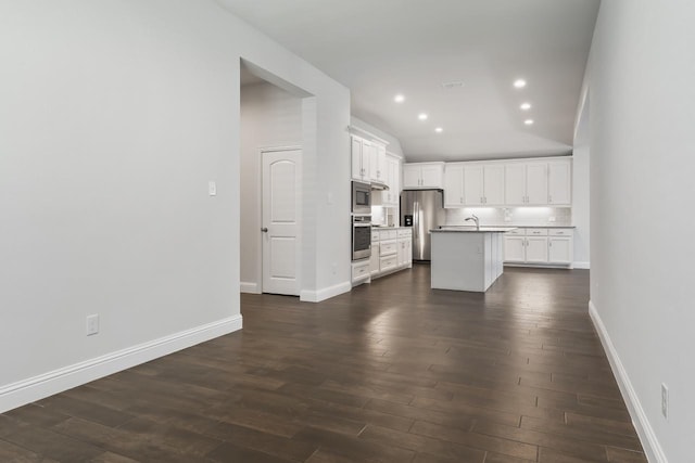 429 Cooper St, Argyle, TX 76226 - kitchen with an island with sink, dark wood finished floors, appliances with stainless steel finishes, and white cabinetry