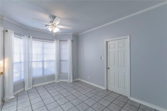spare room with baseboards, ceiling fan, and ornamental molding