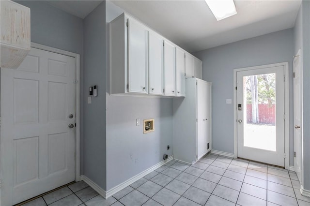 laundry room with cabinet space, light tile patterned floors, baseboards, hookup for an electric dryer, and hookup for a washing machine