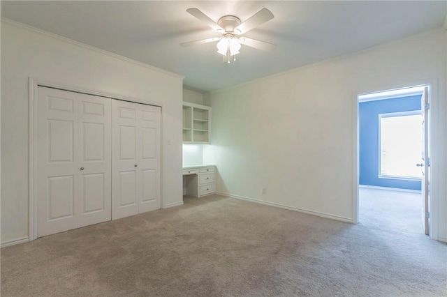 unfurnished bedroom with light carpet, baseboards, a closet, and ornamental molding