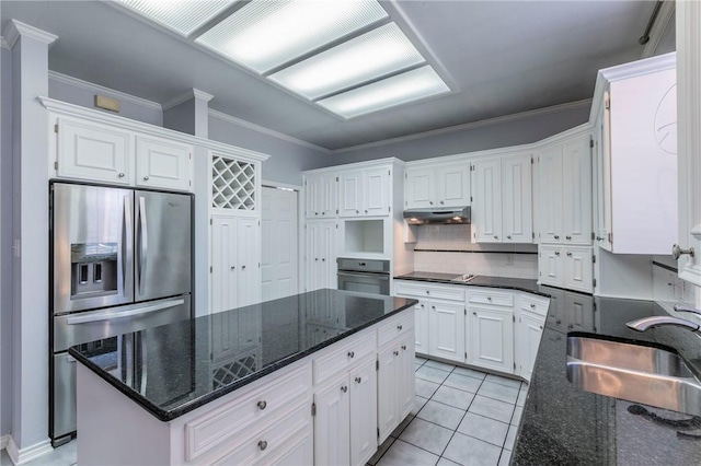 kitchen with black appliances, ornamental molding, under cabinet range hood, a sink, and white cabinets