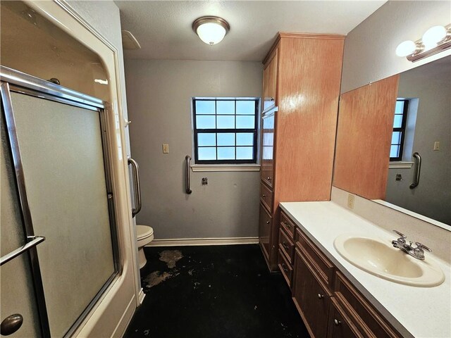 1596 Lcr 800, Groesbeck, TX 76642 - full bath featuring vanity, toilet, a shower with door, and plenty of natural light