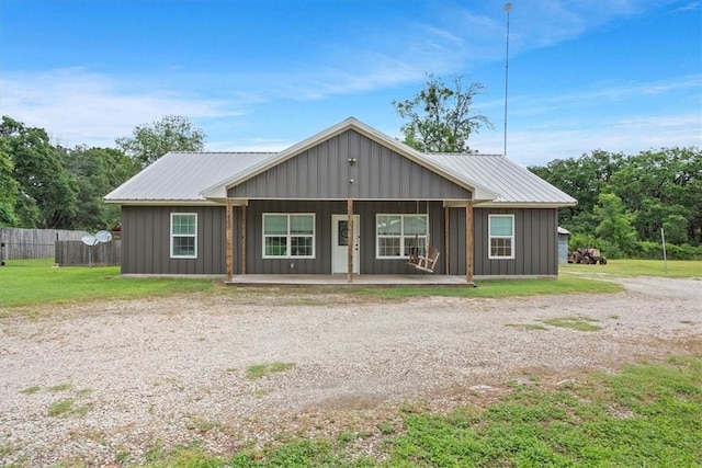 465 Frostdale Dr, Elm Mott, TX 76640 - single story home with board and batten siding, a porch, and a metal roof
