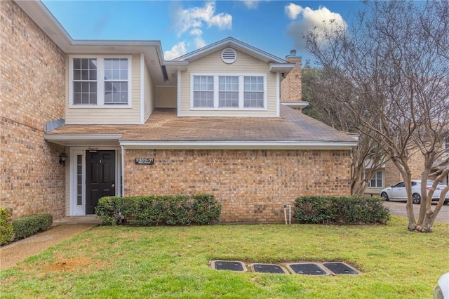 2307 Melissa Dr, Waco, TX 76708 - view of front facade featuring brick siding, a chimney, and a front lawn