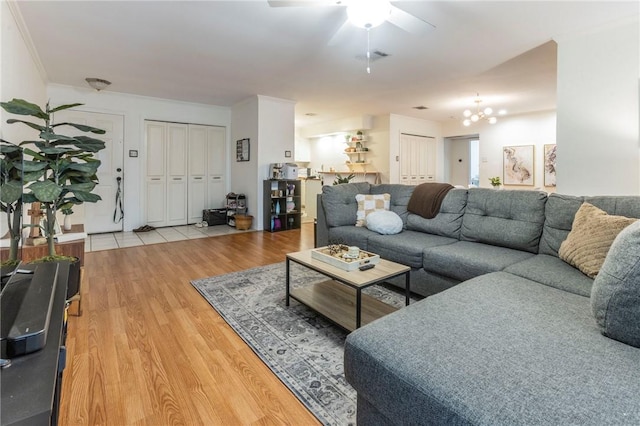 2307 Melissa Dr, Waco, TX 76708 - living area with visible vents, light wood-style flooring, ceiling fan, and ornamental molding