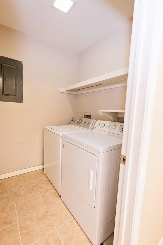 4020 River Oaks Cir, Temple, TX 76504 - laundry area with electric panel, washer and dryer, baseboards, and light tile patterned flooring