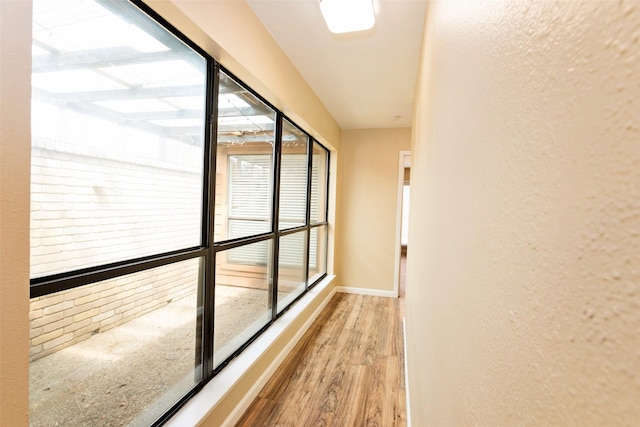 4020 River Oaks Cir, Temple, TX 76504 - hallway featuring wood finished floors, a textured wall, and baseboards