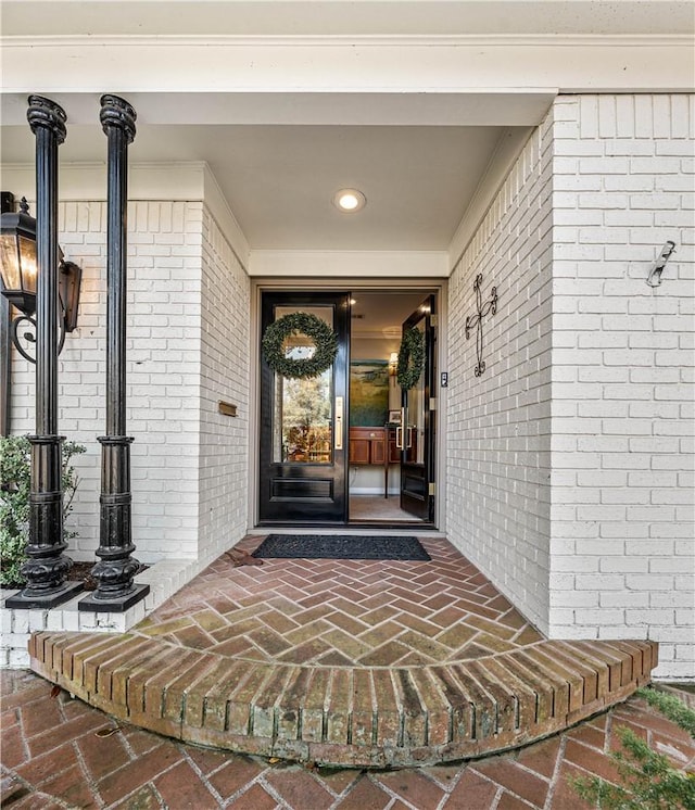property entrance with brick siding