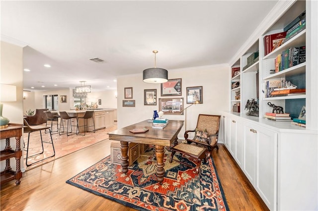 dining room featuring crown molding, recessed lighting, visible vents, and light wood-type flooring