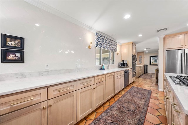 kitchen featuring light stone countertops, visible vents, recessed lighting, light brown cabinetry, and appliances with stainless steel finishes